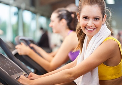a lady on a treadmill doing cardio workout