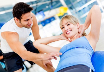 gym woman with a personal training coach